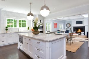 white kitchen with big hanging lights